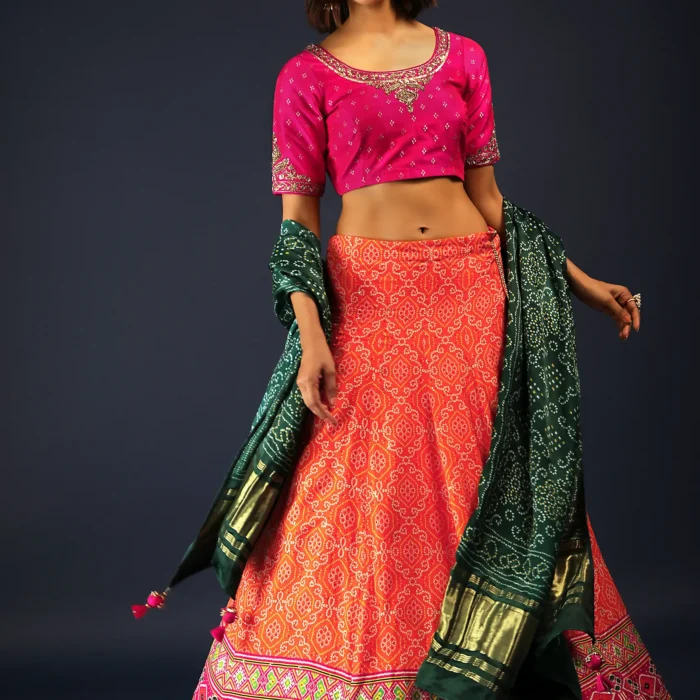 Tangerine Orange Lehenga In Bandhani Printed Silk With Rani Pink Choli And Green Bandhani Dupatta
